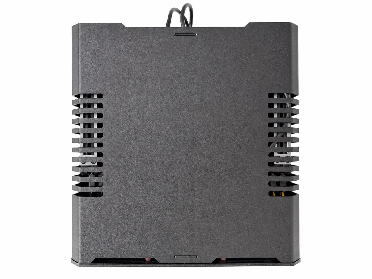 Closed top view of the compact black NAS case with side ventilation slots and internal cabling just visible through the vents.